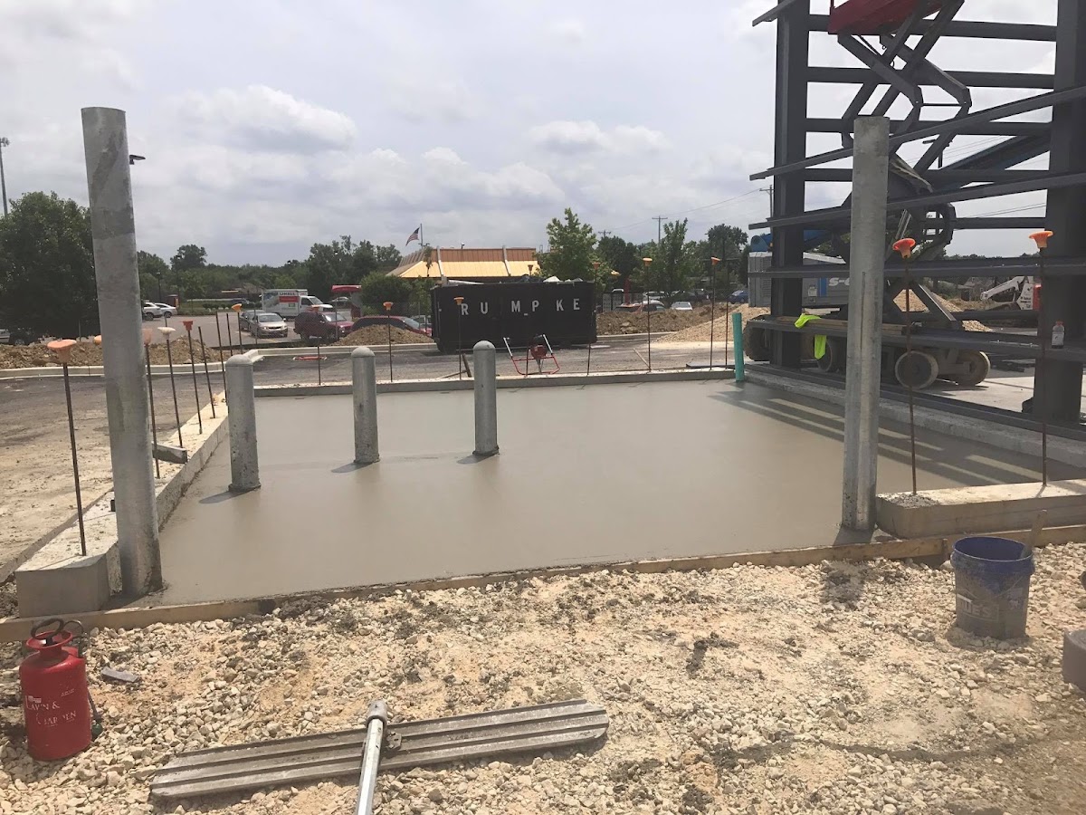 Freshly poured commercial concrete slab at a construction site